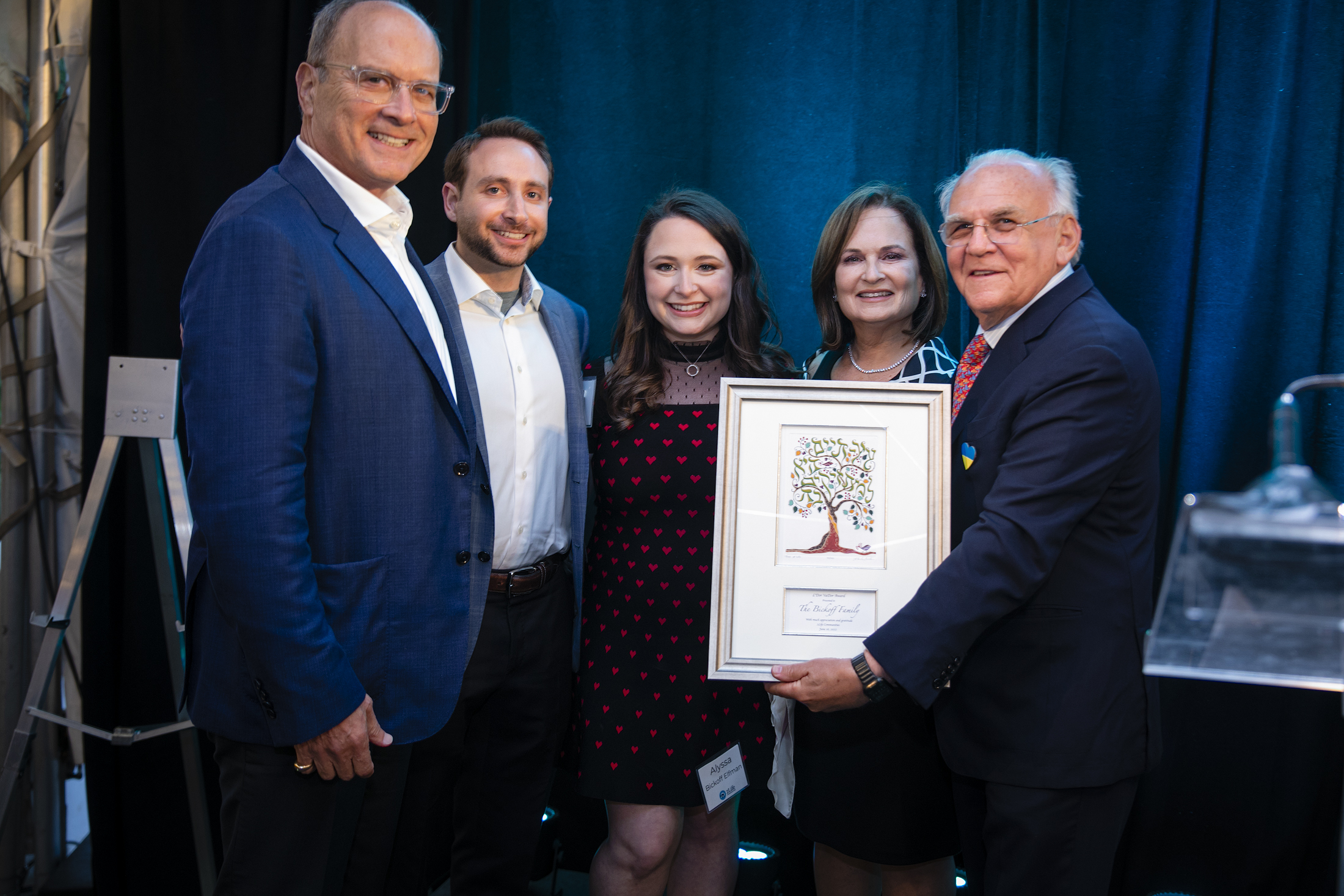 Ed Zuker presenting the Bickoff Family with the L'Dor VaDor Award