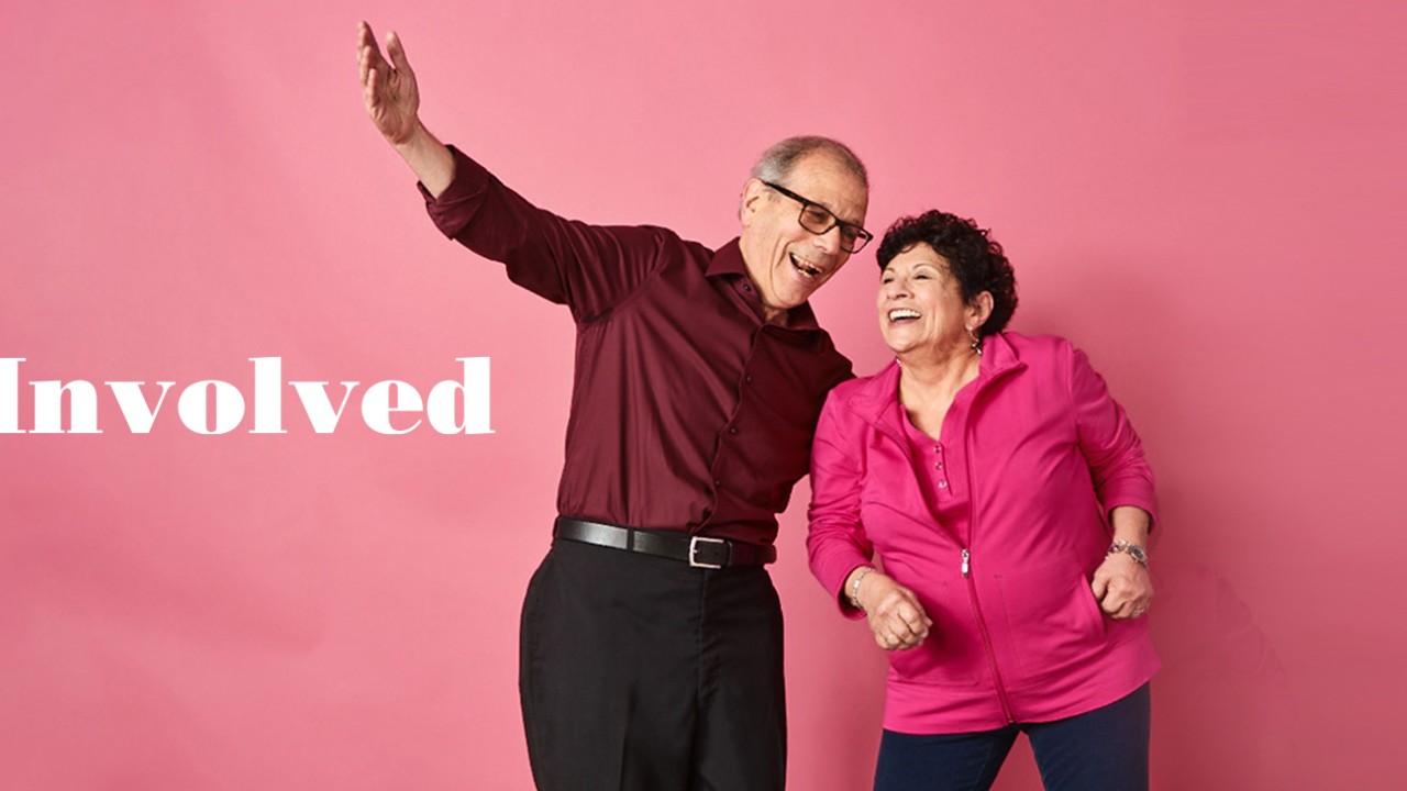 Get Involved banner with two people against a dark pink background