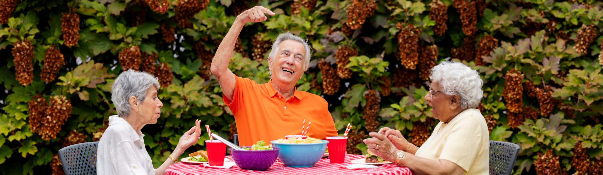 three residents in a 2Life community courtyard