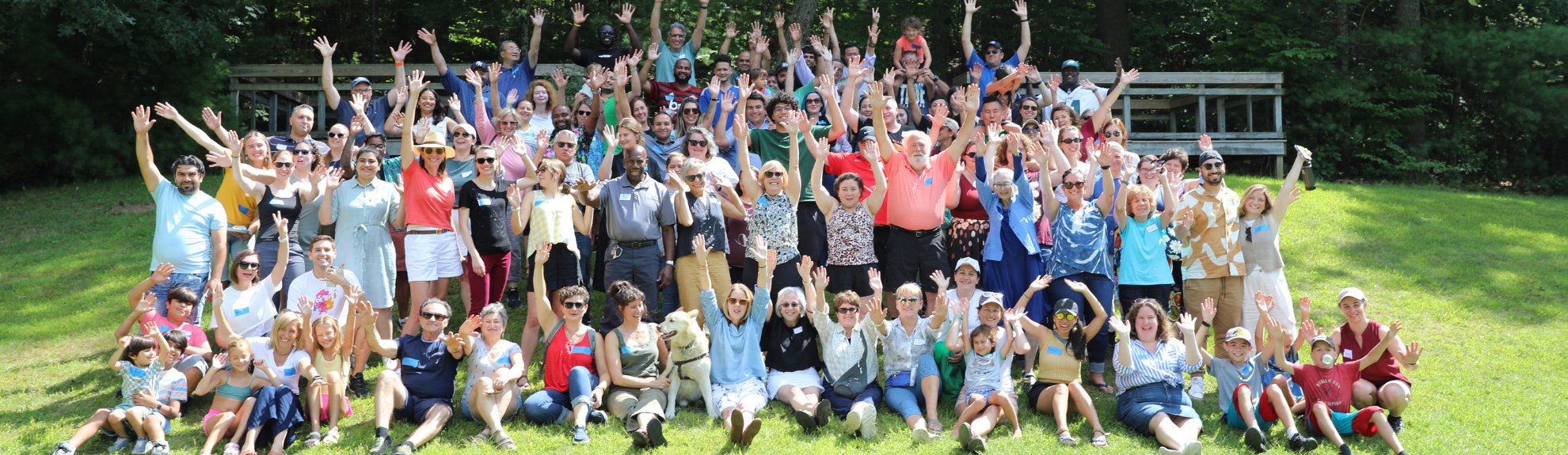 2Life staff members waving at an outdoor event