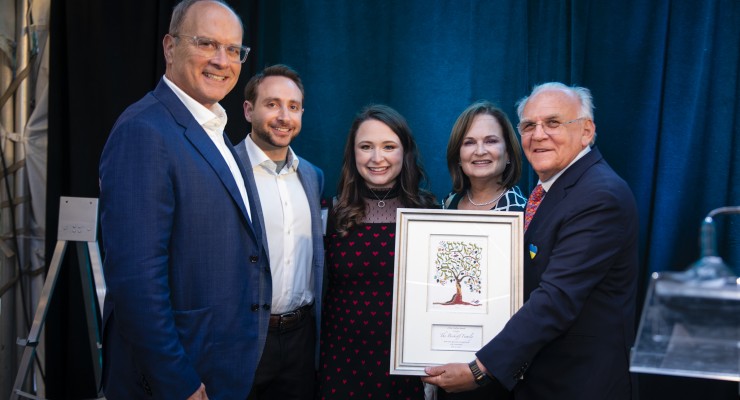 Ed Zuker presenting the Bickoff Family with the L'Dor VaDor Award