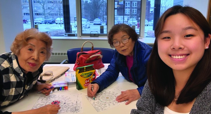 Anna Jee, 2Life volunteer, with two residents