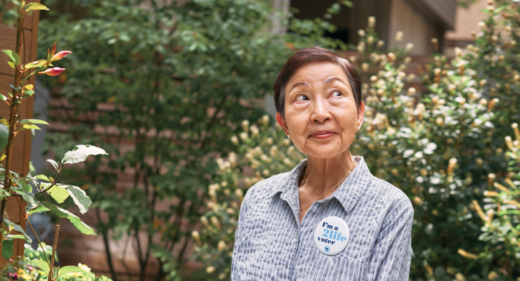 2Life resident wearing a voting pin