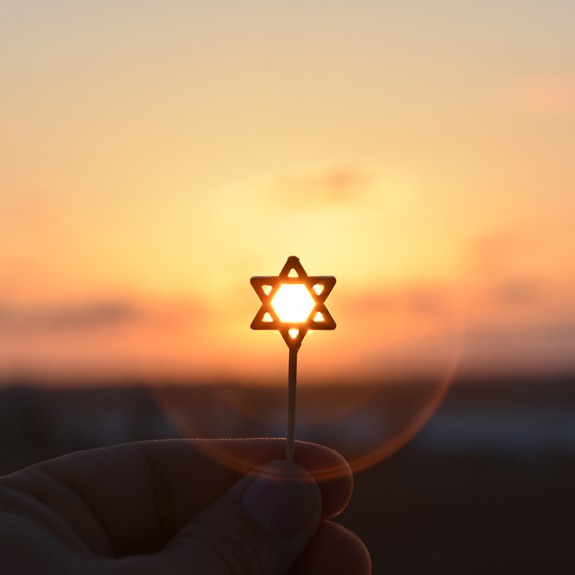 Star of David against a sunset backdrop