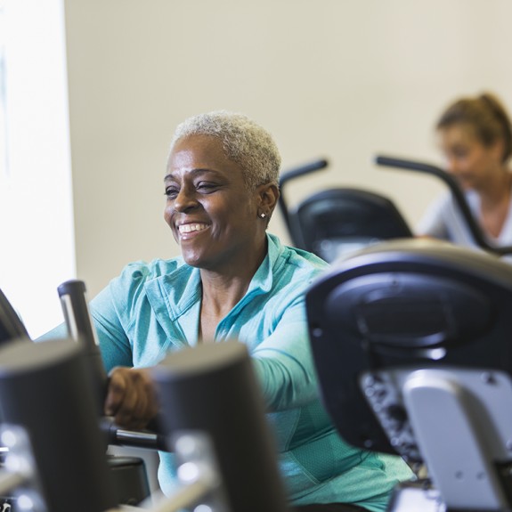 A woman exercising on an exercise bike