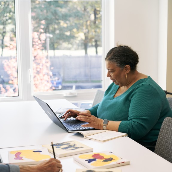 2Life resident using a laptop