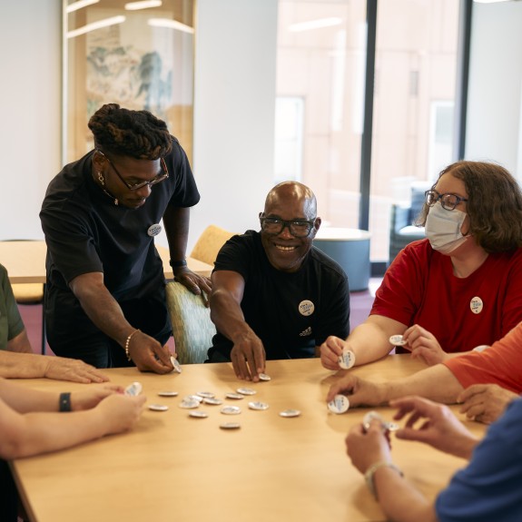 Residents and staff connecting at a campus event