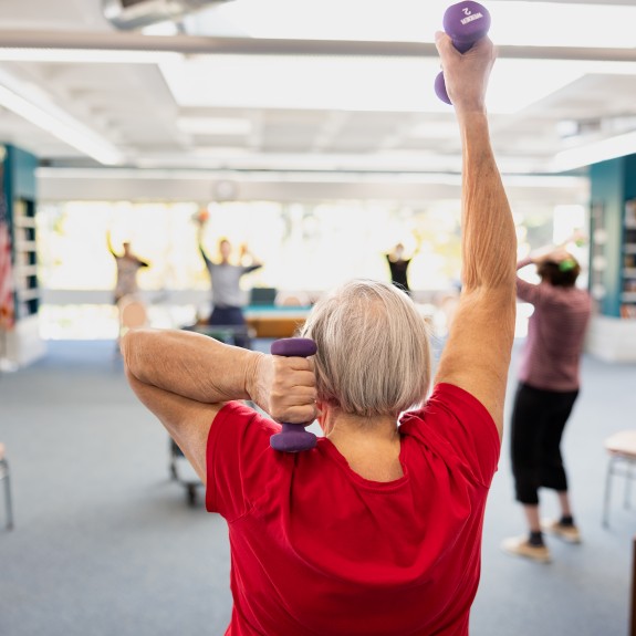 2Life resident exercising inside Brighton Campus