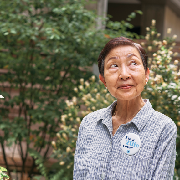 2Life resident wearing a voting pin