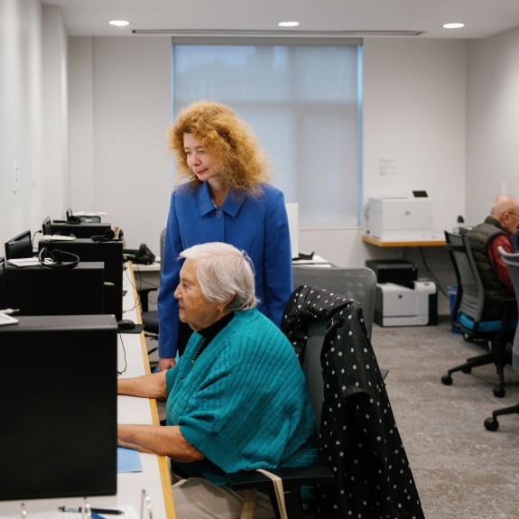 Director of Resident Technology Program Anna Verbuk assisting a resident with technology