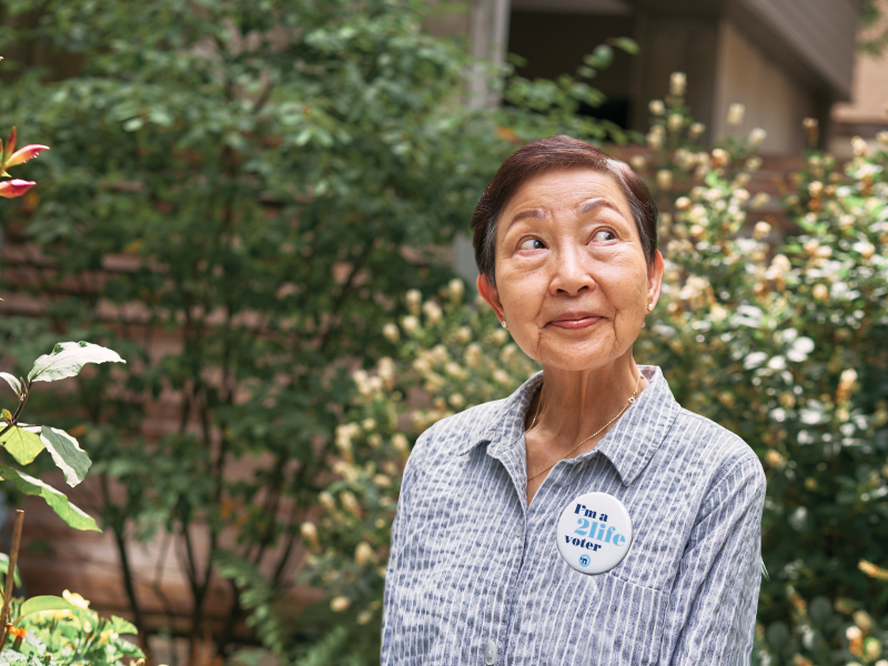 2Life resident wearing a voting pin