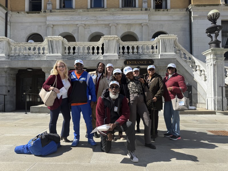 2Life staff and residents posing outside of the state house in Boston, MA
