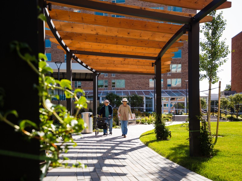 Outdoors in the village center at Brighton Campus
