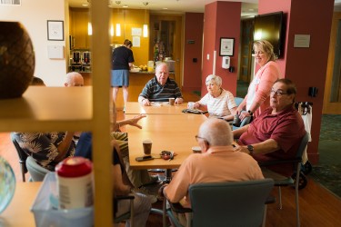 Several people sitting around a large table