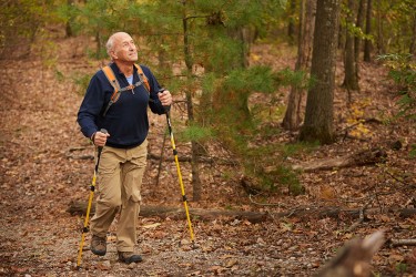 A man hiking with hiking poles