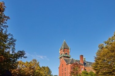Exterior of the Coleman House building against a clear blue sky