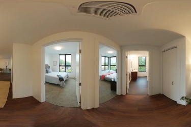 A panoramic view of the bedrooms in a 2-bedroom apartment