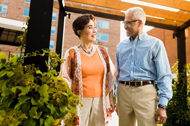 Two people standing together in an open doorway