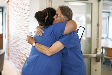 2Life resident and staff member connecting